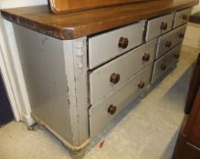 A Victorian grey painted dresser base with pine top,