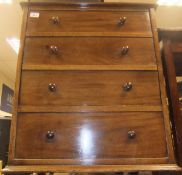 A mahogany cabinet in the form of a four drawer chest,