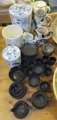 A collection of Wedgwood Black Basalt ware to include coffee cans and saucers, two small jugs,