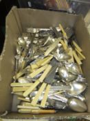 A box of assorted cutlery to include Shell and Fiddle pattern table cutlery,