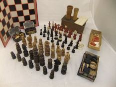 A box containing a Victorian stained boxwood and ebony chess set with bone decoration, together with