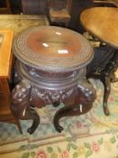 A circa 1900 Chinese carved hardwood jardiniere stand,