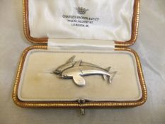 A George Jensen sterling silver brooch in the form of two dolphins