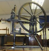 A stained oak spinning wheel