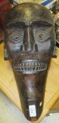 A large ethnic carved wood tribal head