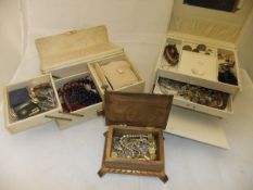 Three jewellery boxes containing various costume jewellery to include rings, brooches, etc,