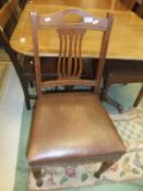 A set of six circa 1900 oak framed dining chairs with rexine seats,