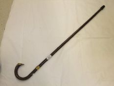 An 18 carat gold mounted walking stick