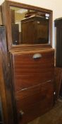 A mahogany wall-mounted washstand, the upper section with water tank,