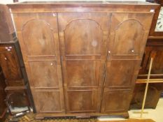 An early 20th Century walnut triple wardrobe compactum in the Dutch taste,