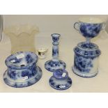 A collection of late 19th Century flow blue pottery gentleman's companion set to include twin-