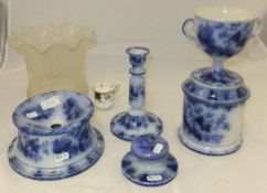 A collection of late 19th Century flow blue pottery gentleman's companion set to include twin-