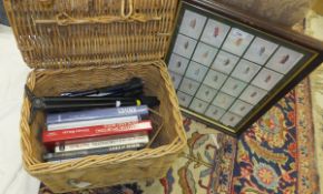 A wicker picnic basket containing a collection of sporting related books to include "The British