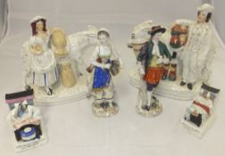 A pair of early 20th Century Dresden figures, a pair of Staffordshire figure groups,