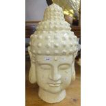 A large cream glazed terracotta Buddha head