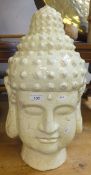 A large cream glazed terracotta Buddha head