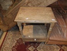 A rectangular pine wash stand on ringed and turned supports united by and undertier,