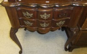 A Dutch style mahogany two drawer side table with acanthus carved legs