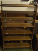 An oak open bookcase with seven shelves, in the Arts and Crafts manner CONDITION REPORTS Has three