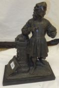 A patinated bronze figure of a 16th Century writer stood by an ivy encrusted pedestal