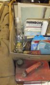 A collection of items to include two khaki safari camp beds, a red metal vintage petrol can,