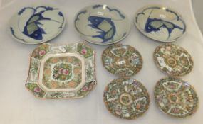 Three Oriental bowls decorated with fish, together with a Chinese porcelain famille-rose square