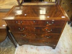 A 19th Century mahogany chest of four long drawers on bracket feet