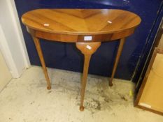 An oak reproduction demi-lune hall table
