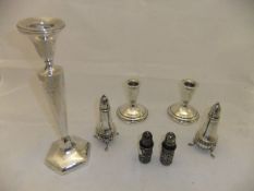 A pair of squat candlesticks on circular stepped base, stamped "Sterling" to base,