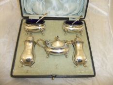 A George V silver cased cruet comprising lidded mustard,