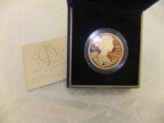 A "The Queen's Diamond Jubilee UK £5 gold plated silver proof coin" (in presentation box)