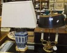 A modern Chinese blue and white vase table lamp with cream shade,