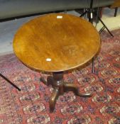 A 19th Century circular mahogany tripod table on ringed and turned central support to tripod base