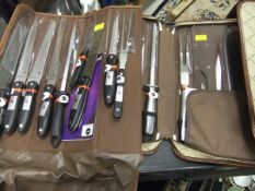 Two 9 piece knife sets in cases *