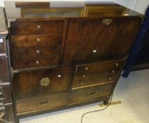 A 20th Century stained wood secretaire cabinet with various drawers and cupboard doors CONDITION