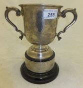 A silver trophy cup inscribed "National Pony Show Stallion Class ...", on a black plastic socle