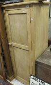 A slim pine cupboard, the single panelled door opening to reveal shelves CONDITION REPORTS Size