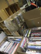 A collection of CD racks, together with two boxes of assorted CDs and DVDs,