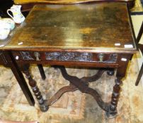An oak single drawer side table in the 17th Century manner on bobbin turned  supports united by an
