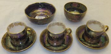 A mid to late 1920's Maling bowl with blue lustre ground decorated with Eastern birds pattern, a set