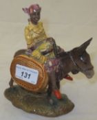 A Beswick pottery "Susie Jamaica" figurine depicting a girl riding a donkey, model No. 1347