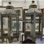 Two large metal lantern candle holders with verdigris finish