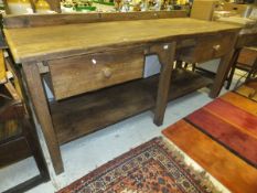 A 19th Century pine kitchen work bench/work unit, the rectangular top with two suspended drawers