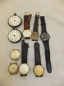 A box containing assorted wristwatches and pocket watches,