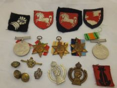 A box containing a set of World War II medals comprising the 1939-45 Star, the Africa Star, the