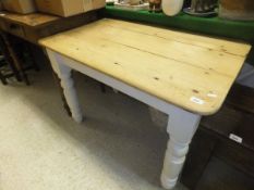 A pine topped kitchen table with white painted base CONDITION REPORTS Various splits, cracks and