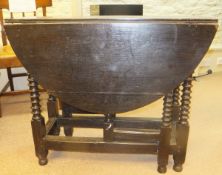 A 19th Century oak oval gate-leg table on bobbin turned legs, united by stretchers CONDITION REPORTS