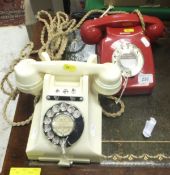 A red plastic cased vintage telephone,