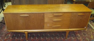 A "Jentique" of East Dereham teak dining suite, comprising a side board,