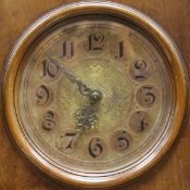 A late 19th Century German walnut cased long case clock, the stepped hood over a circular dial
